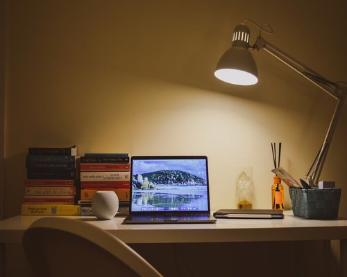 Study desk setup with warm lamp