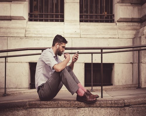 Person holding smartphone in a bus