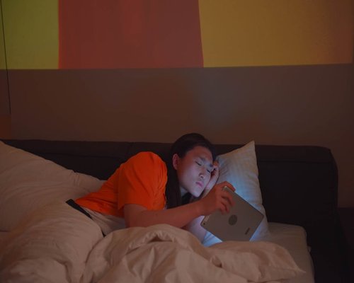 Using tablet in bed with ambient lighting