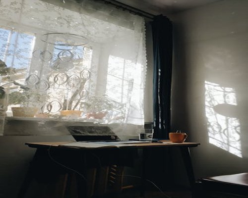 Sunlight streaming through window onto a desk